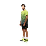 Man wearing a gradient sports outfit with black and yellow shoes on a white background